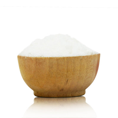 Wooden bowl filled with Aluminium Acetate Mordant on a white background
