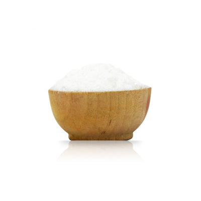 Wooden bowl filled with Aluminium Acetate Mordant on a white background