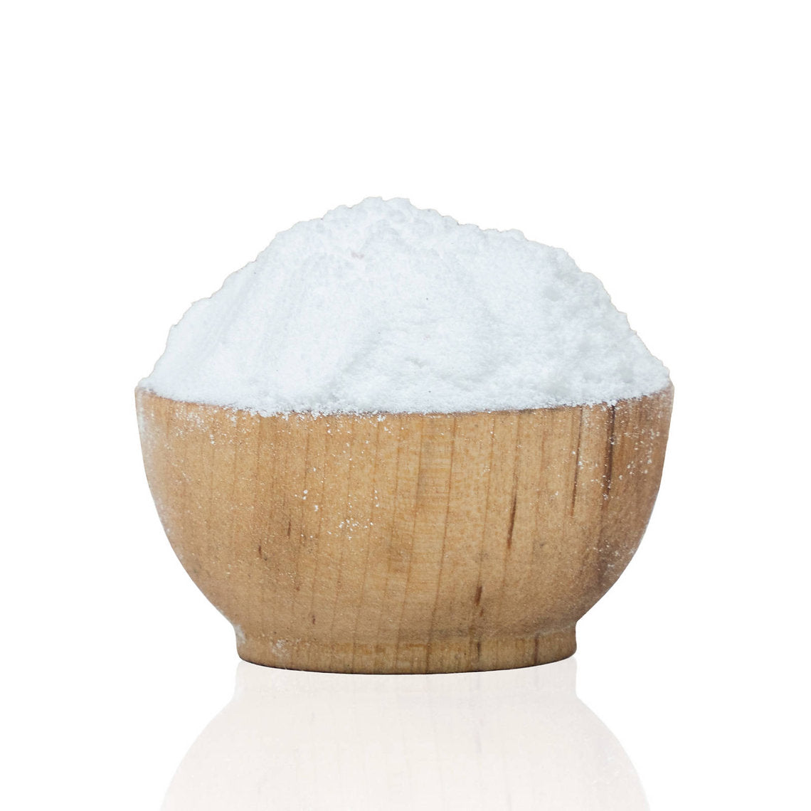 Wooden bowl filled with white salt Cream Of Tartar on a white background