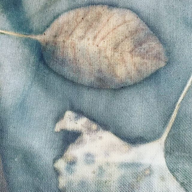 Close-up of a textured stone on a textured fabric surface