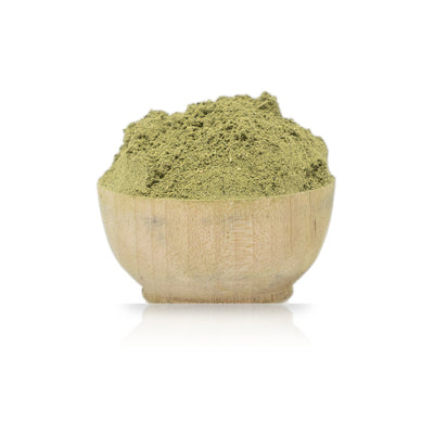 Green Indigo Powder (Indigofera Tinctoria) Organic in a wooden bowl on a white background