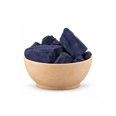 Two dark blue stones on a white background