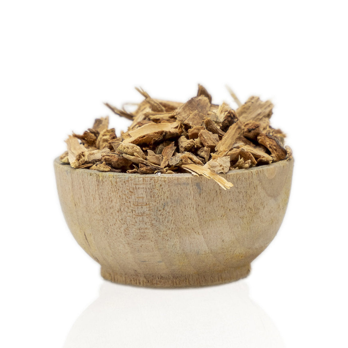 Wooden bowl filled with dried Poplar Bark (Populus nigra) on a white background