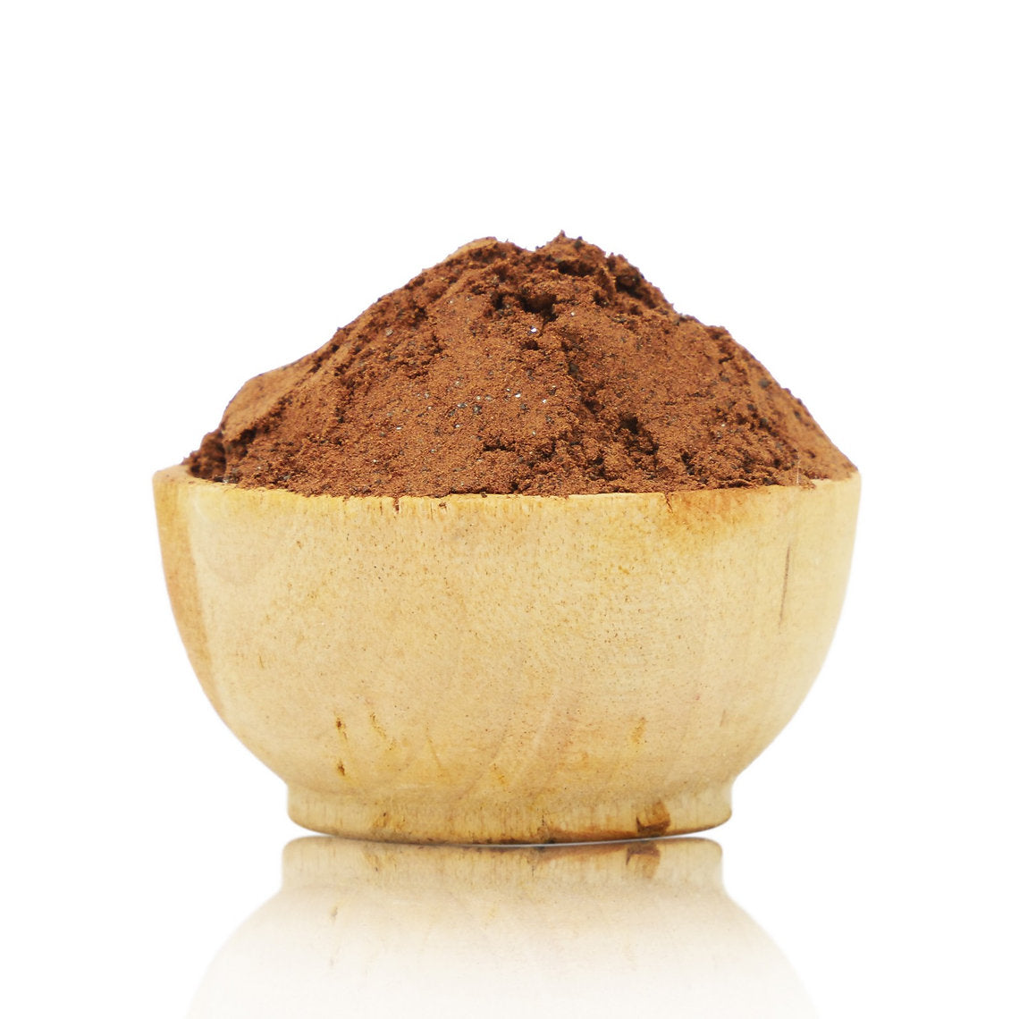 Wooden bowl filled with brown powder on a white background