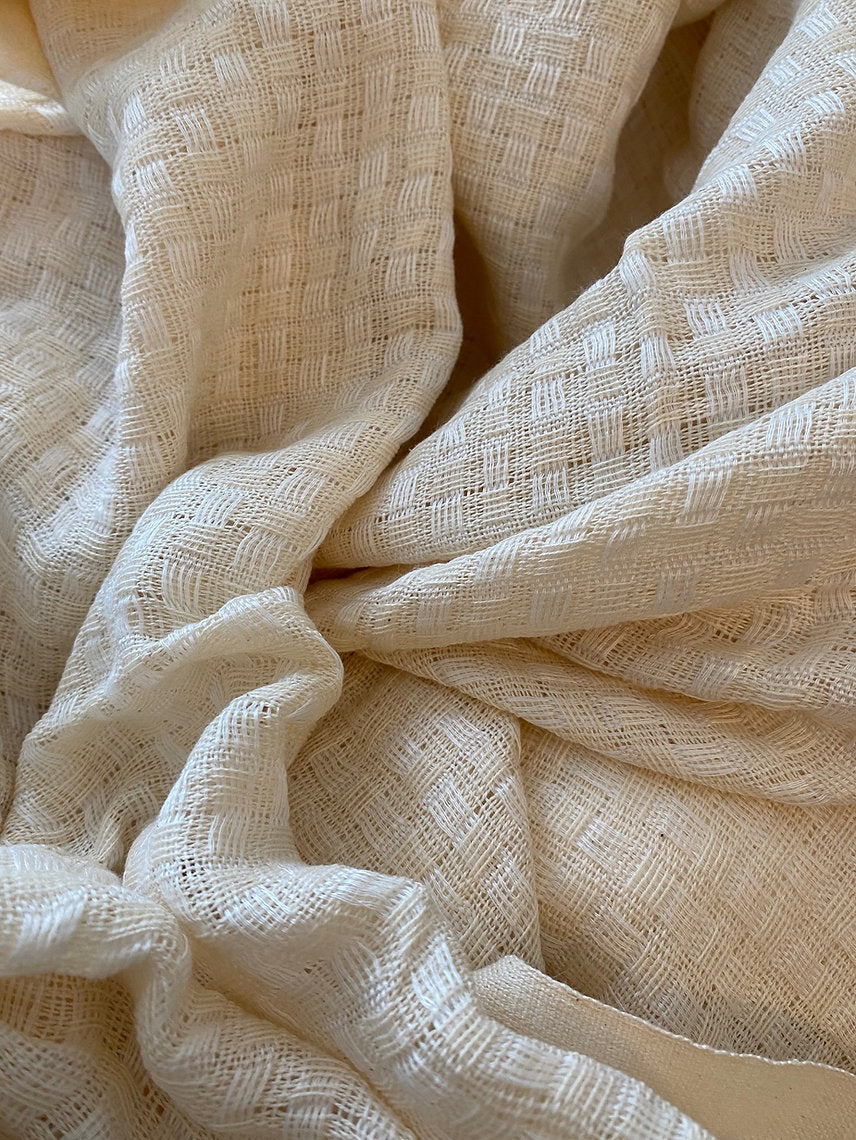 Close-up of beige textured fabric