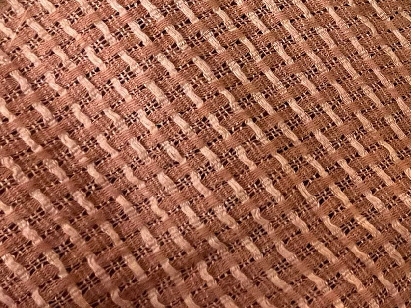 Close-up of brown woven fabric texture
