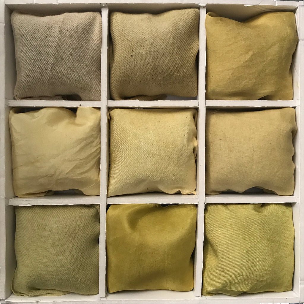 Nine green fabric bags arranged in a 3x3 grid on a white background