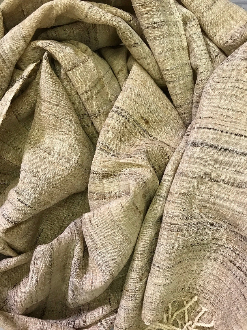 Close-up of textured beige scarf with subtle patterns