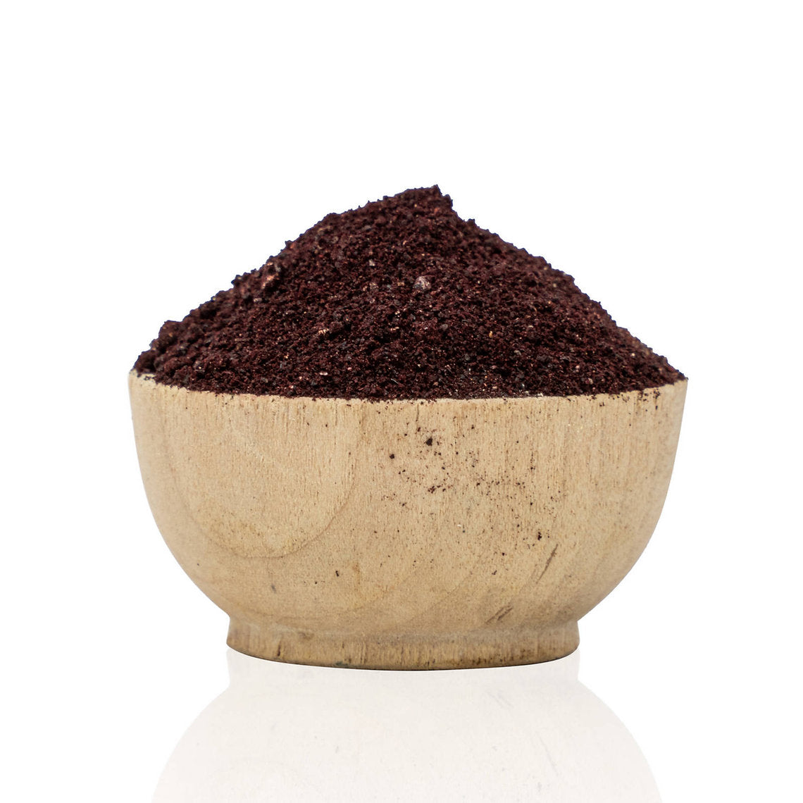 Wooden bowl filled with Cochineal Powder (Dactylopius coccus) organic dark brown ground on a white background