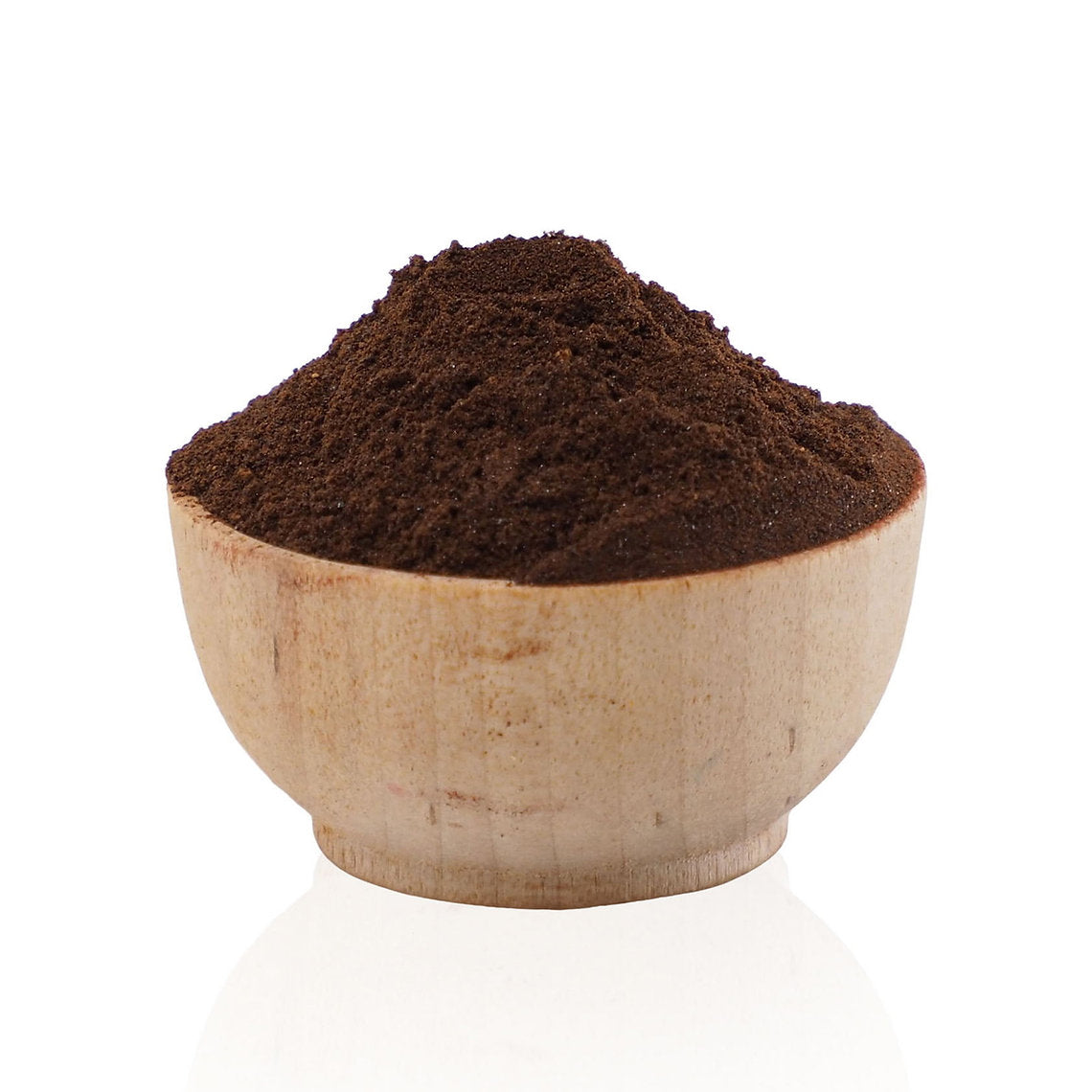 Wooden bowl filled with Cutch Extract (Cathechu) dark brown  on a white background