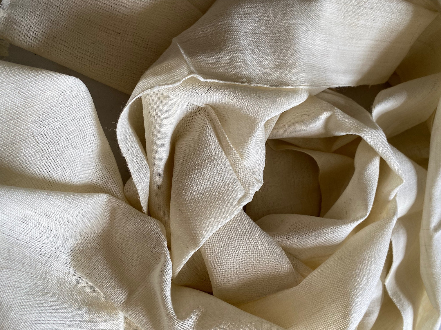 Close-up of beige fabric with folds