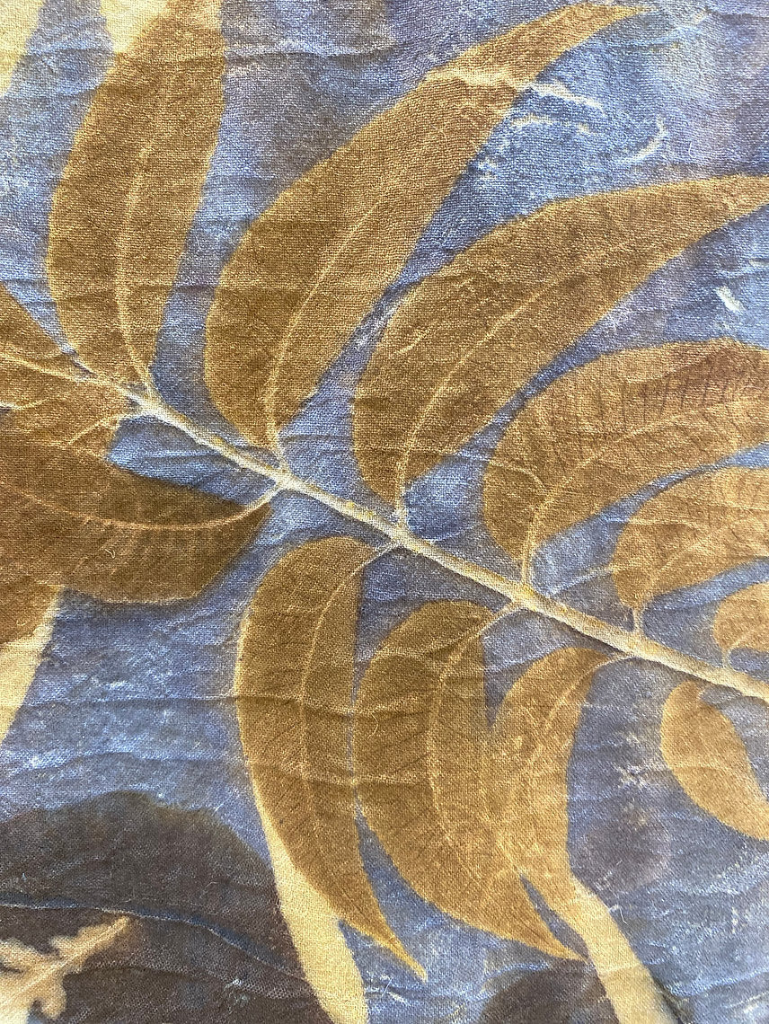 Textile with gold leaf pattern on a blue background