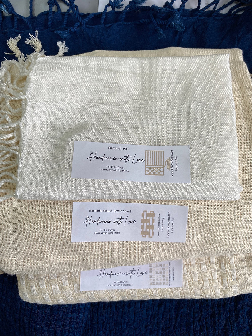 Beige fabric with 'Handwoven with Love' labels on a blue background