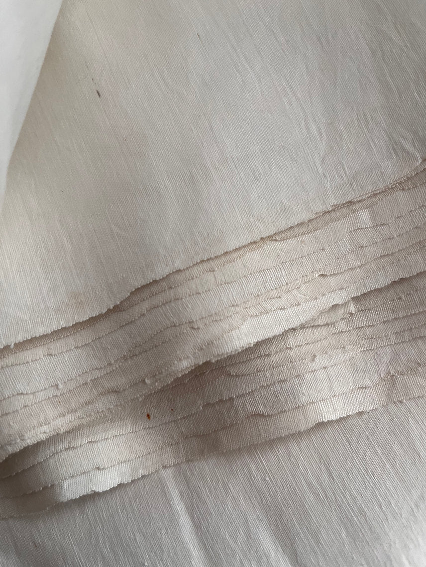 Close-up of beige fabric with visible texture