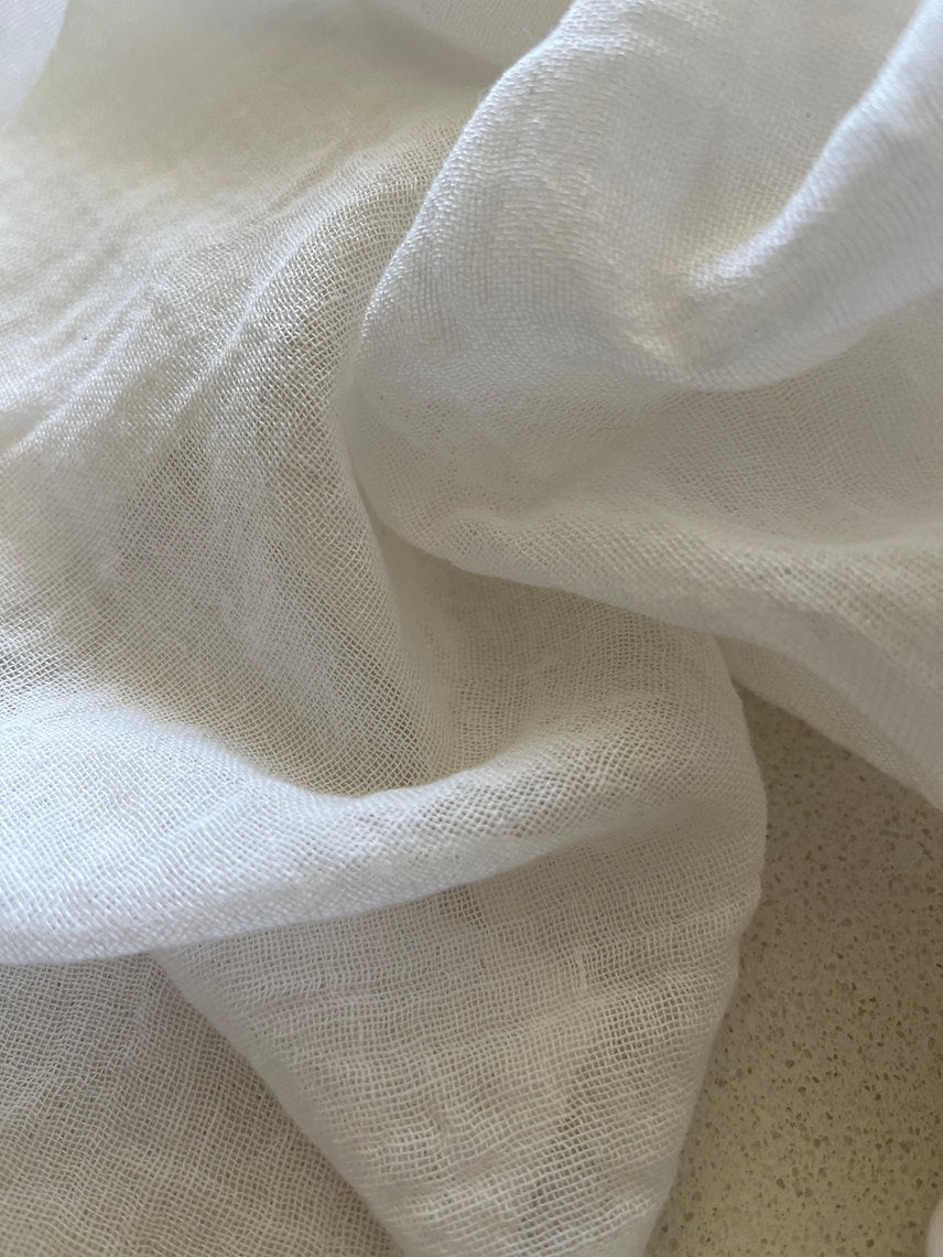 Close-up of white fabric with a textured surface