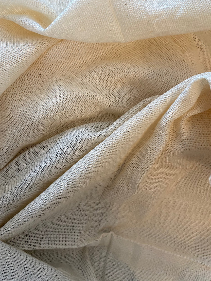 Close-up of beige fabric with visible texture