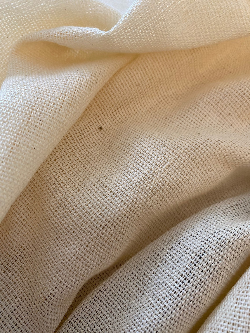 Close-up of beige fabric with a textured pattern