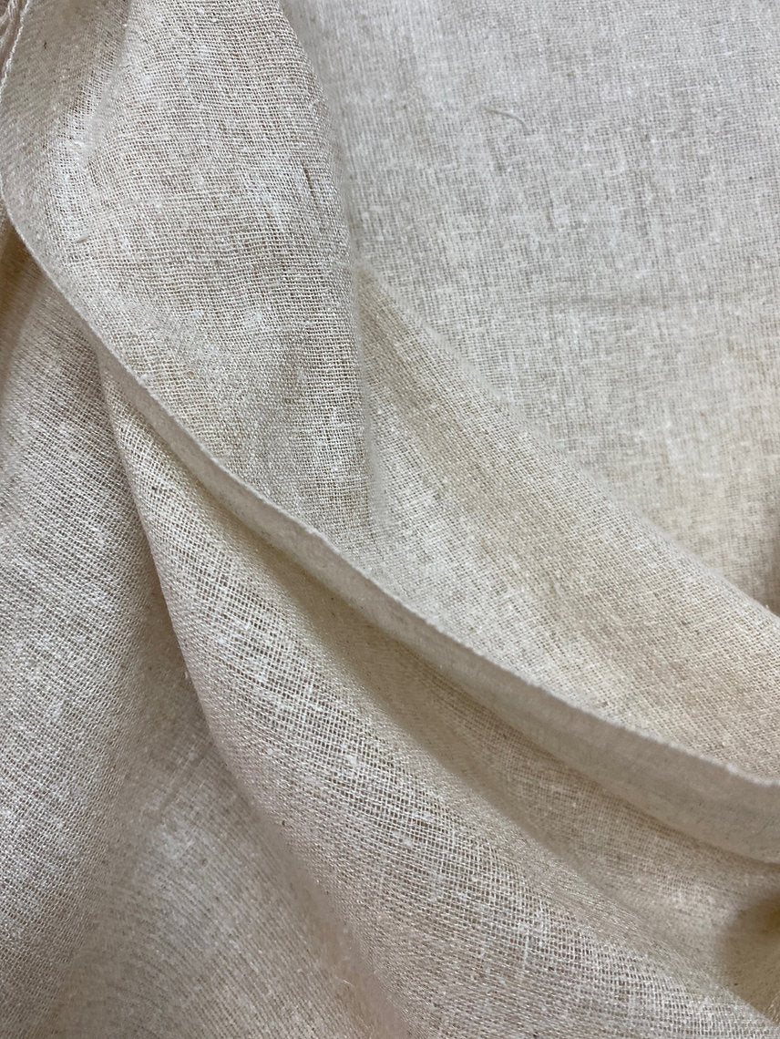 Close-up of beige fabric with a textured pattern