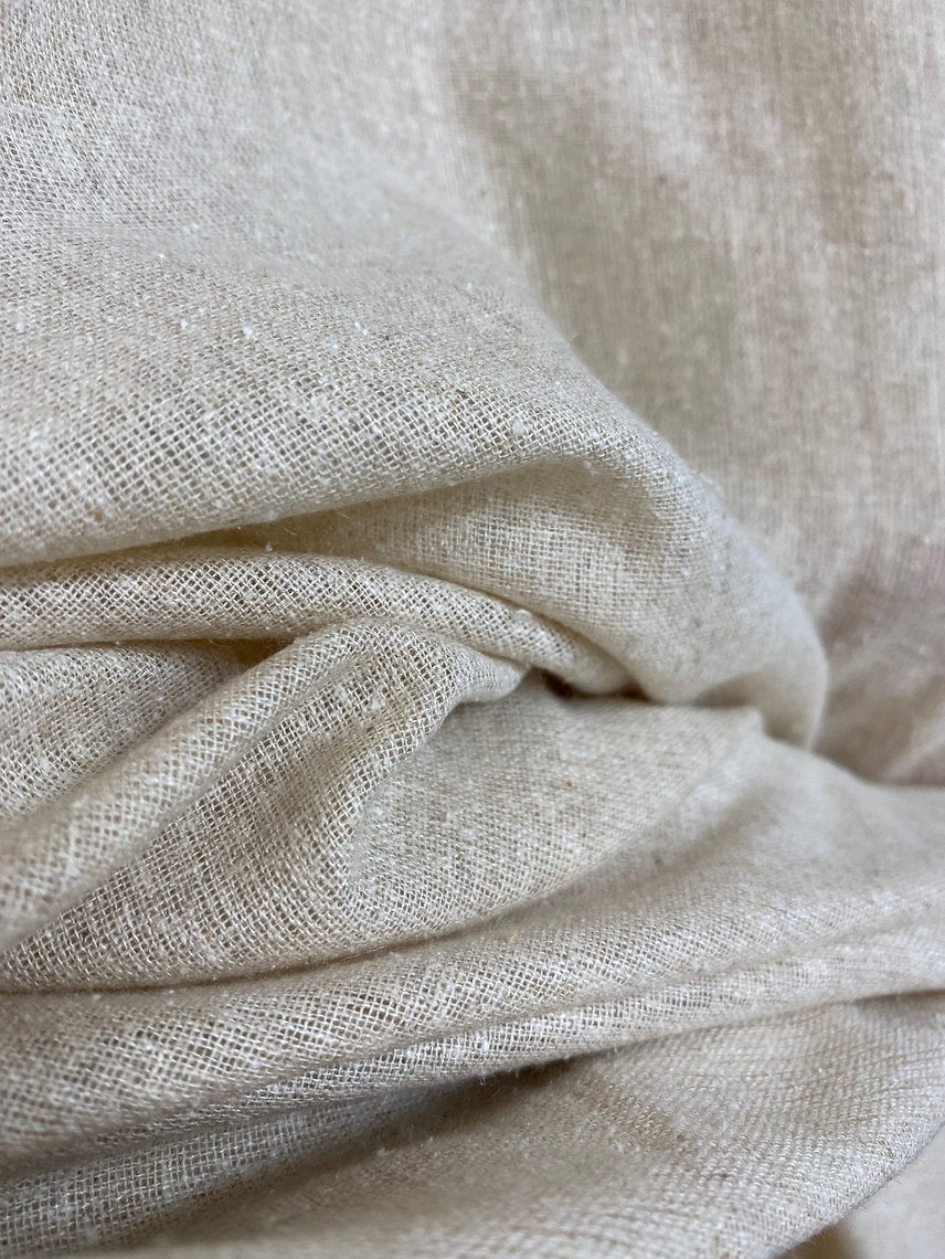 Close-up of beige fabric with a textured pattern