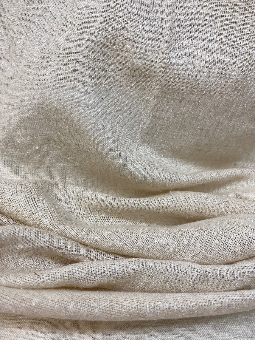 Close-up of beige fabric with visible texture
