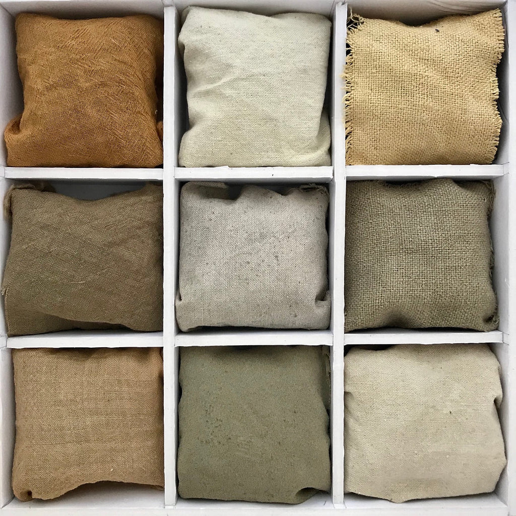 Nine fabric samples in various green neutral colors arranged in a grid.
