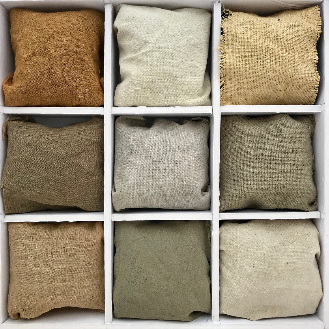 Nine fabric samples in various green neutral colors arranged in a grid.