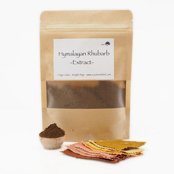 Kraft paper packaging of Hymalayan Rhubarb Extract with a small bowl of powder and samples on a white background.
