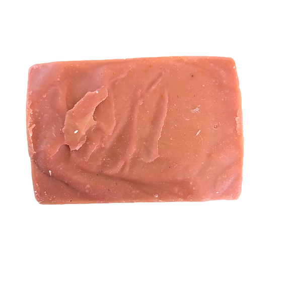 Bar of pink soap on a white background