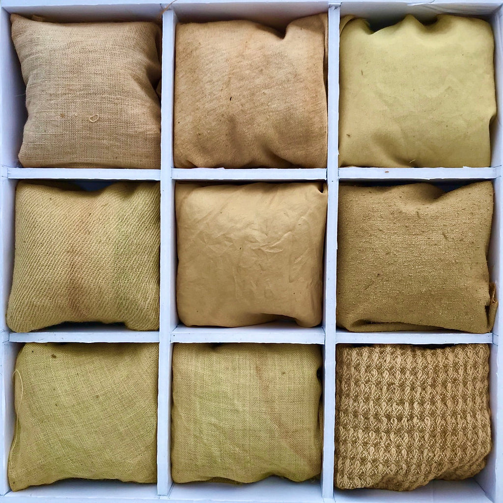 Nine brown fabric dyed Horse Chestnut Bark (Aesculus hippocastanum) bags arranged in a 3x3 grid within a white box.