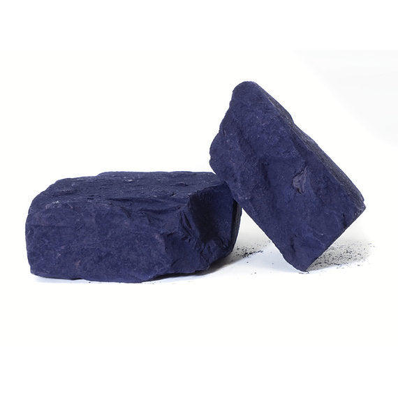 Two dark blue stones on a white background
