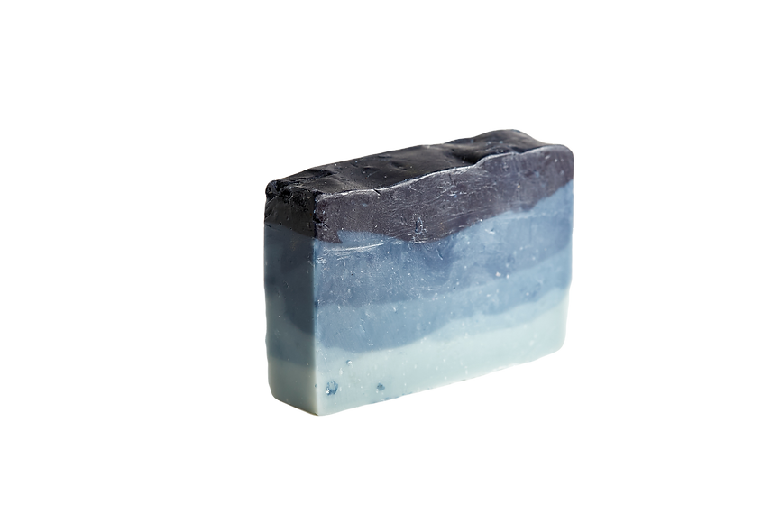 Gradient soap bar transitioning from black to blue on a white background