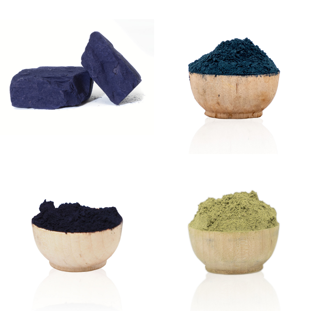 Two wooden bowls with dark blue and green powders on a white background