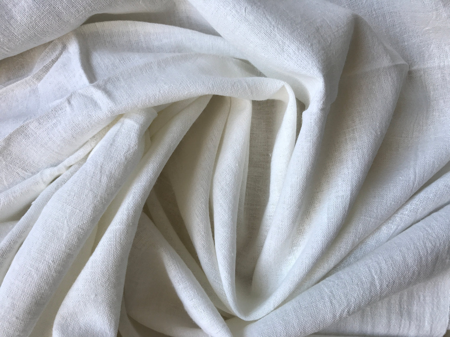 Close-up of white fabric with folds