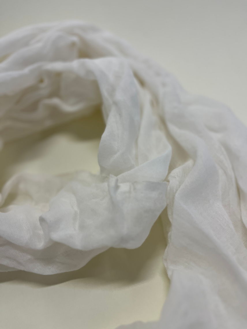 Close-up of white fabric on a light background