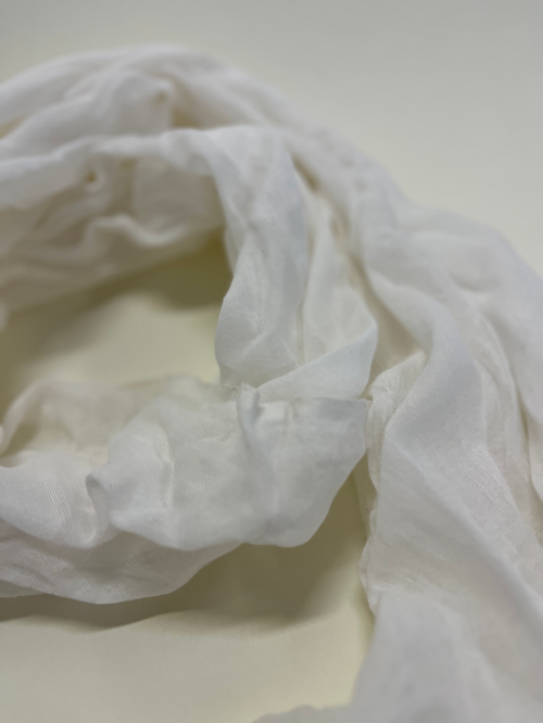 Close-up of white fabric on a light background