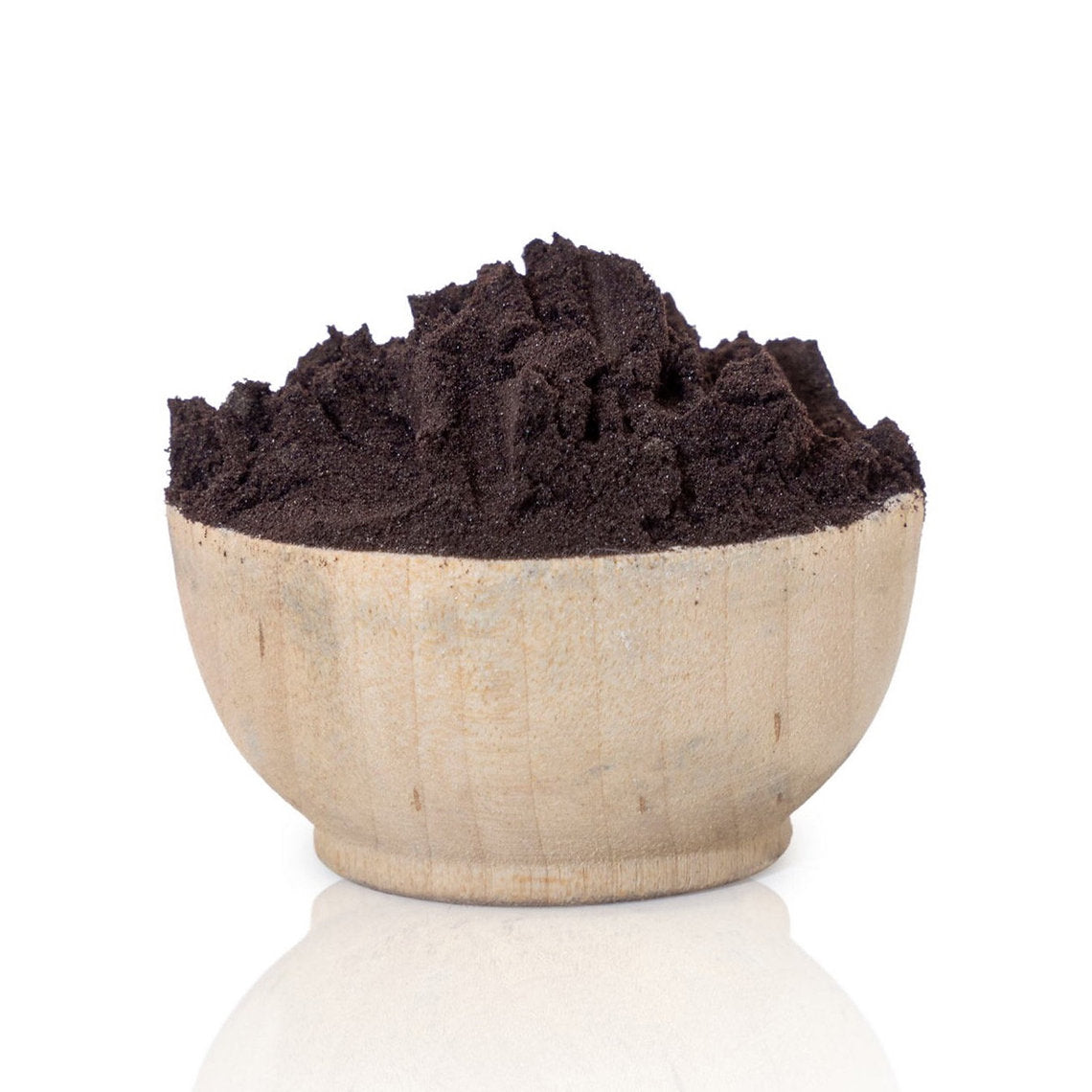 Bowl filled with dark brown Logwood Extract (Haematoxylum campechianum) powder on a white background