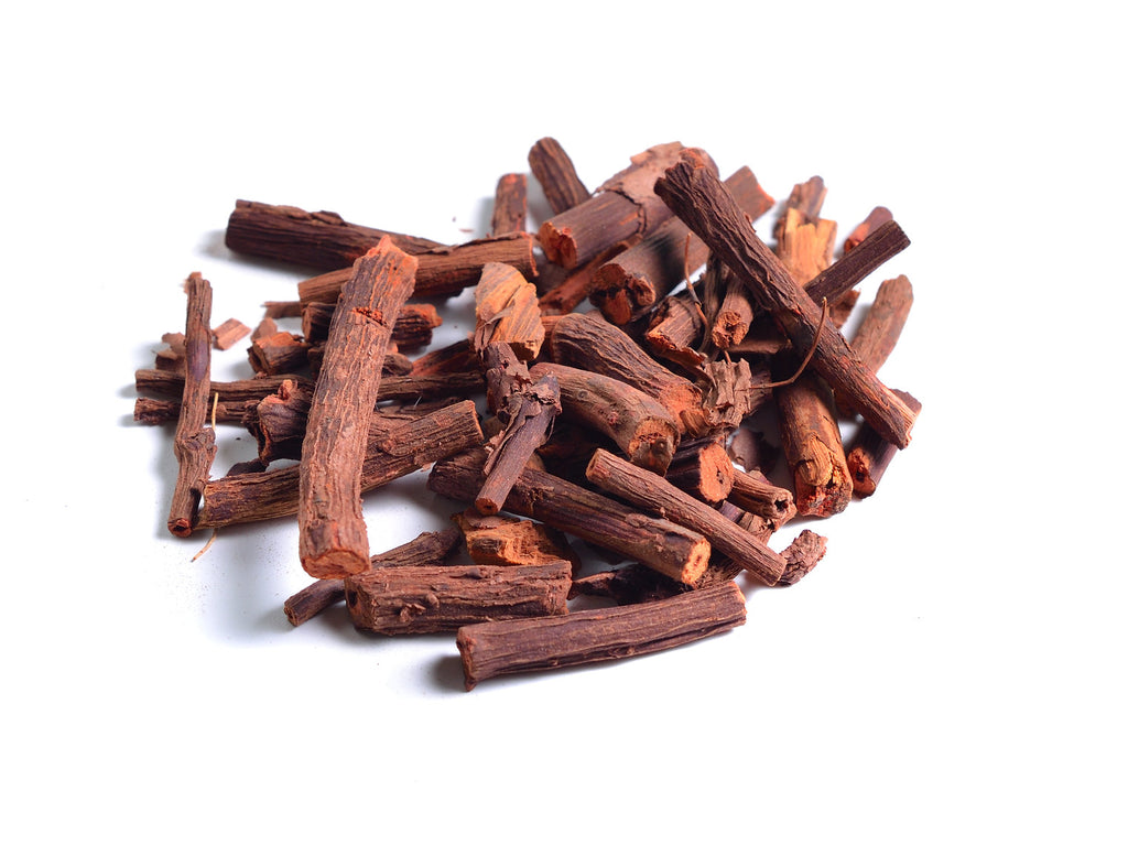 Pile of dried Madder Extract EXTRA (Rubia Tinctorum) Alizarin sticks on a white background