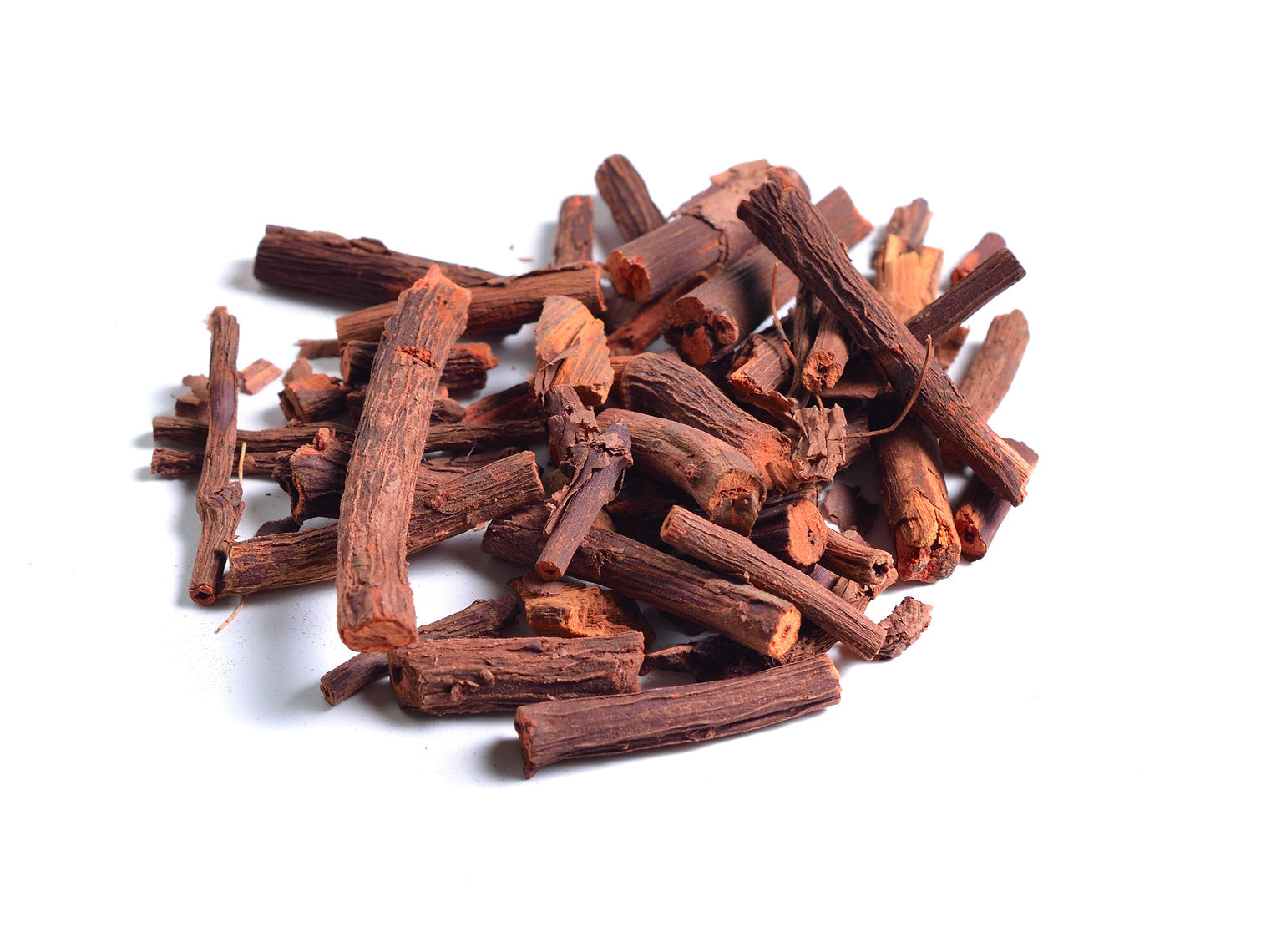 Pile of dried Madder Extract EXTRA (Rubia Tinctorum) Alizarin sticks on a white background