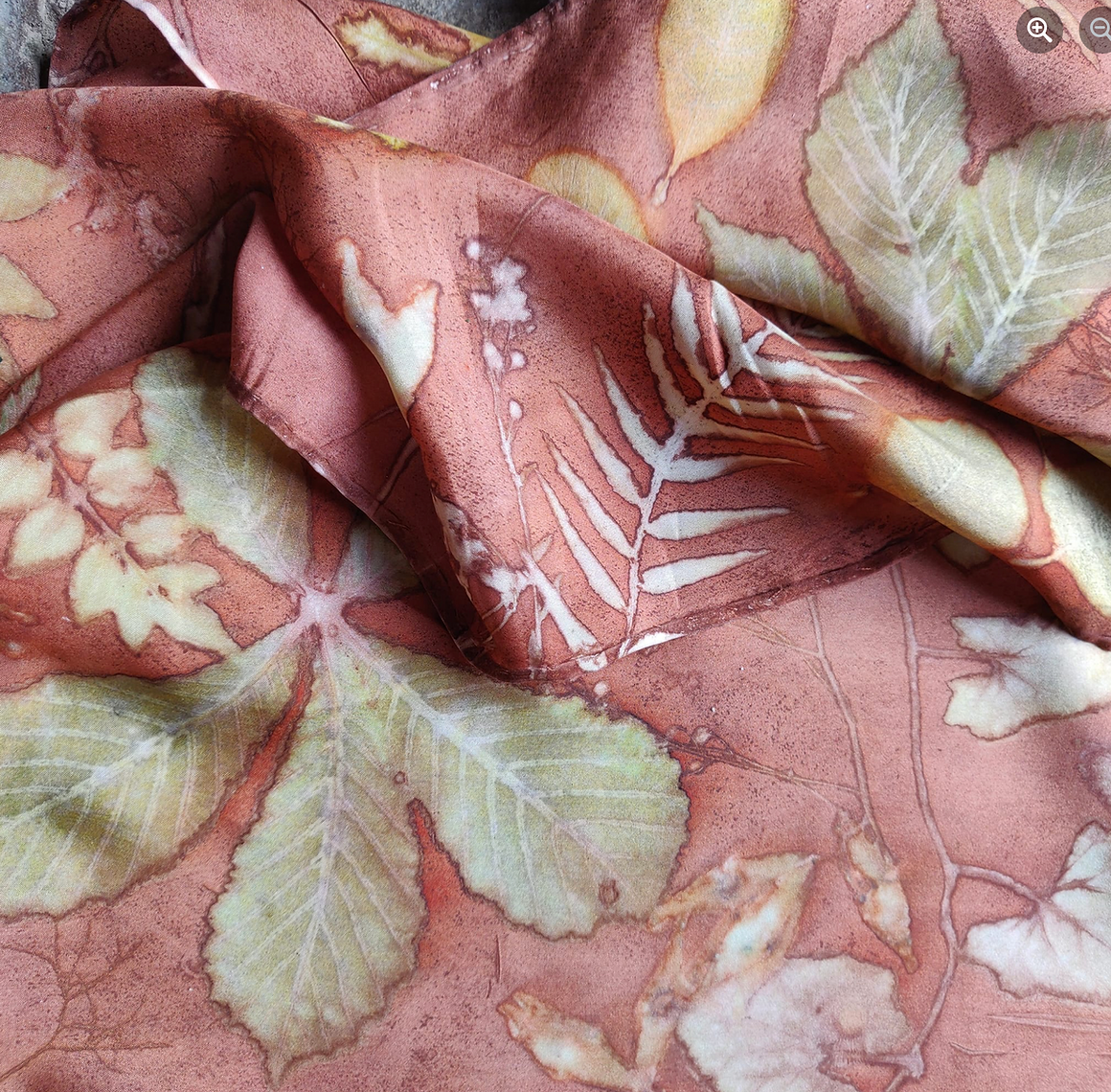 Close-up of fabric with leaf pattern on a pink background