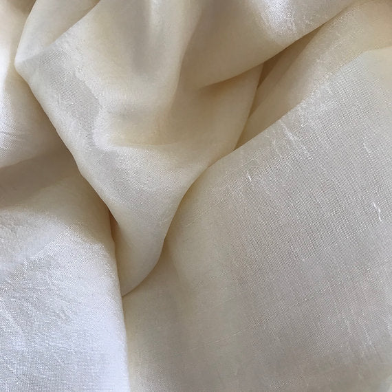 Close-up of beige fabric with a soft texture