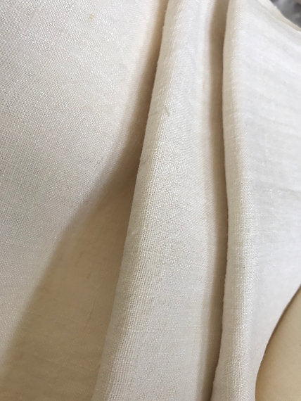 Close-up of beige fabric with a subtle texture