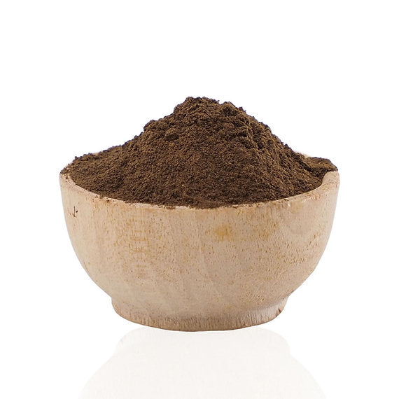 Brown Myrobalan Extract (Terminalia Chebula) powder in a wooden bowl on a white background