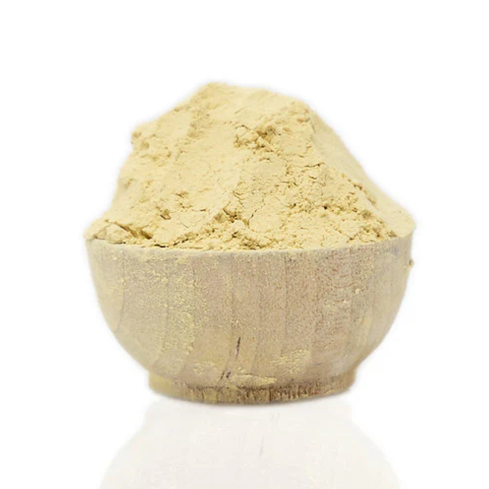 Beige powder in a stone bowl on a white background