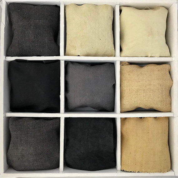 Grid of fabric swatches in various colors including black, gray, and beige.