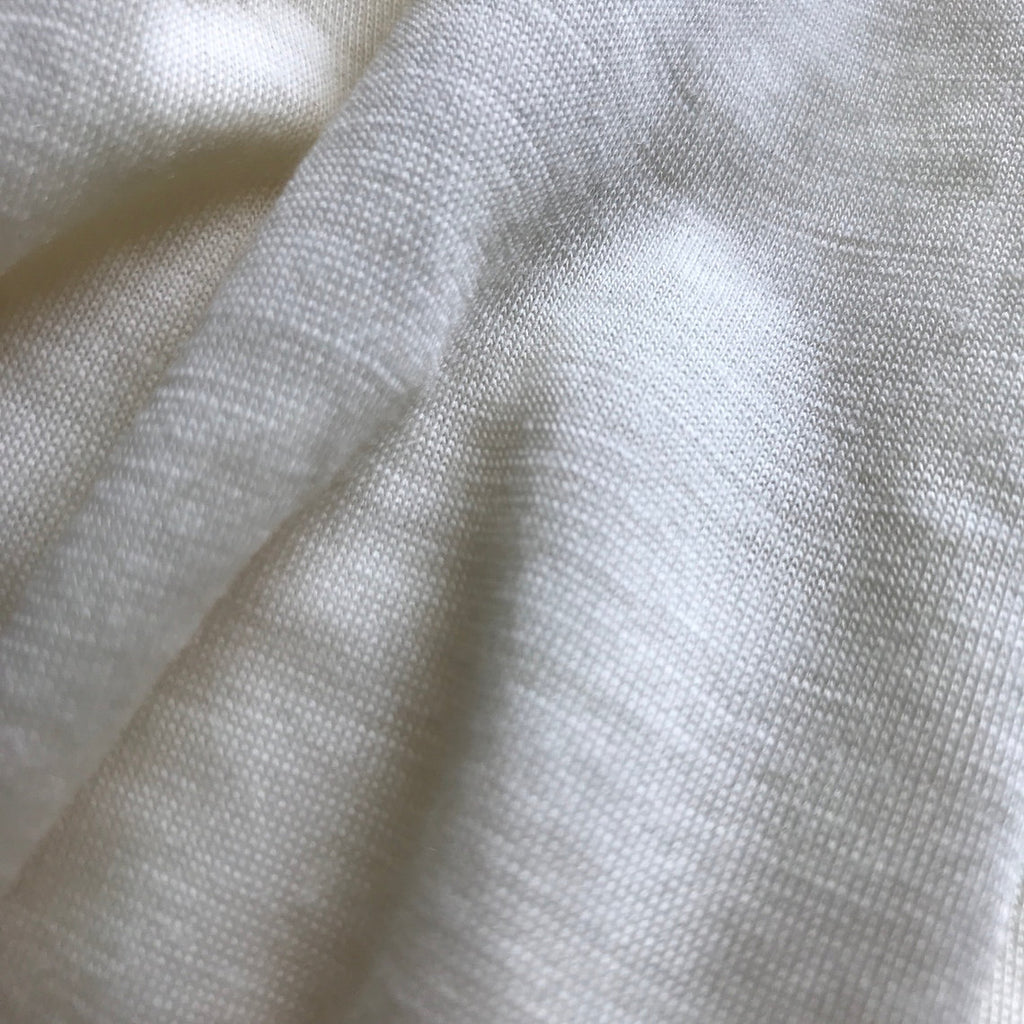 Close-up of white fabric with a textured pattern