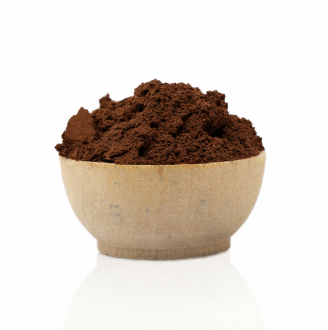 Brown powder in a wooden bowl on a white background