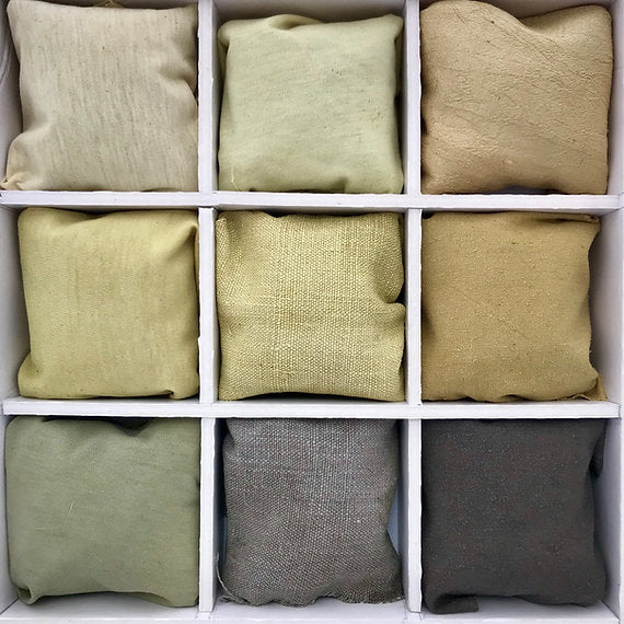 Nine white gray green black fabric samples arranged in a grid on a white background