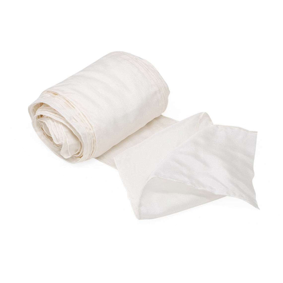 Rolled-up white silk fabric on a white background