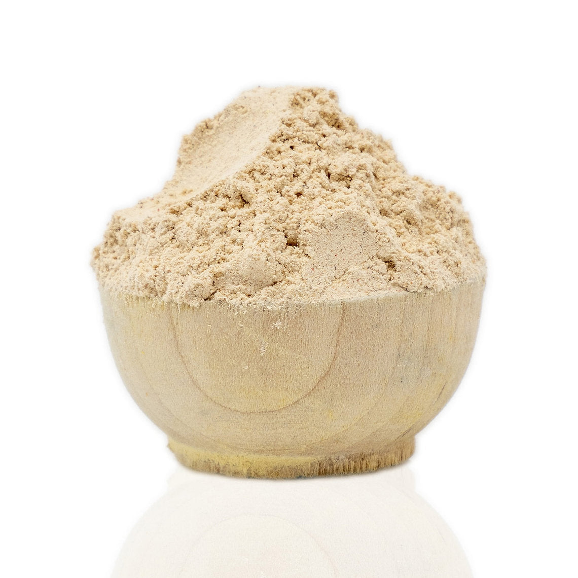 Wooden bowl filled with beige Tara Powder (Caesalpinia Spinosa) on a white background