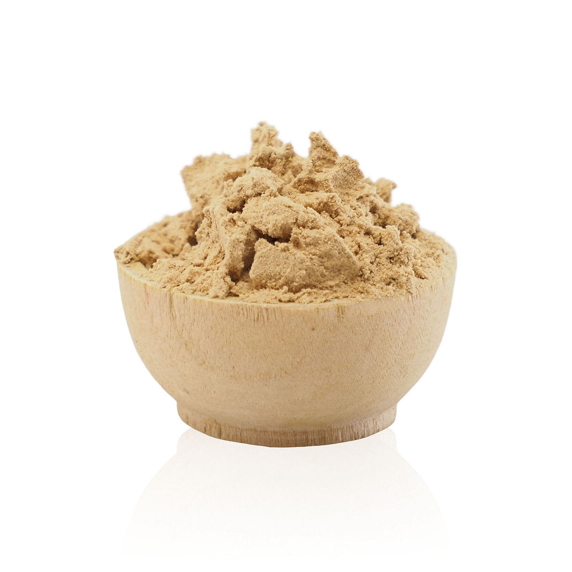 Wooden bowl filled with brown powder on a white background